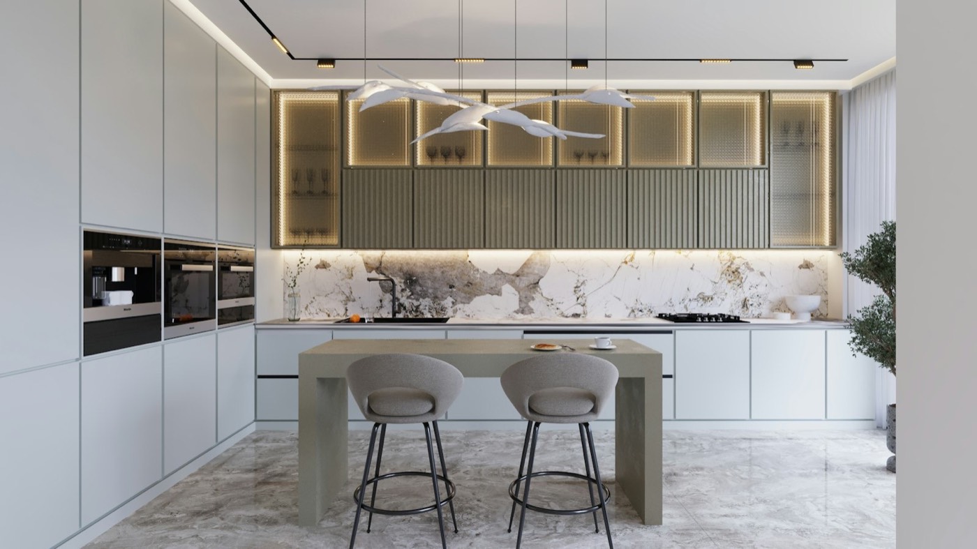 A kitchen with pale cabinets, a long island and three stools